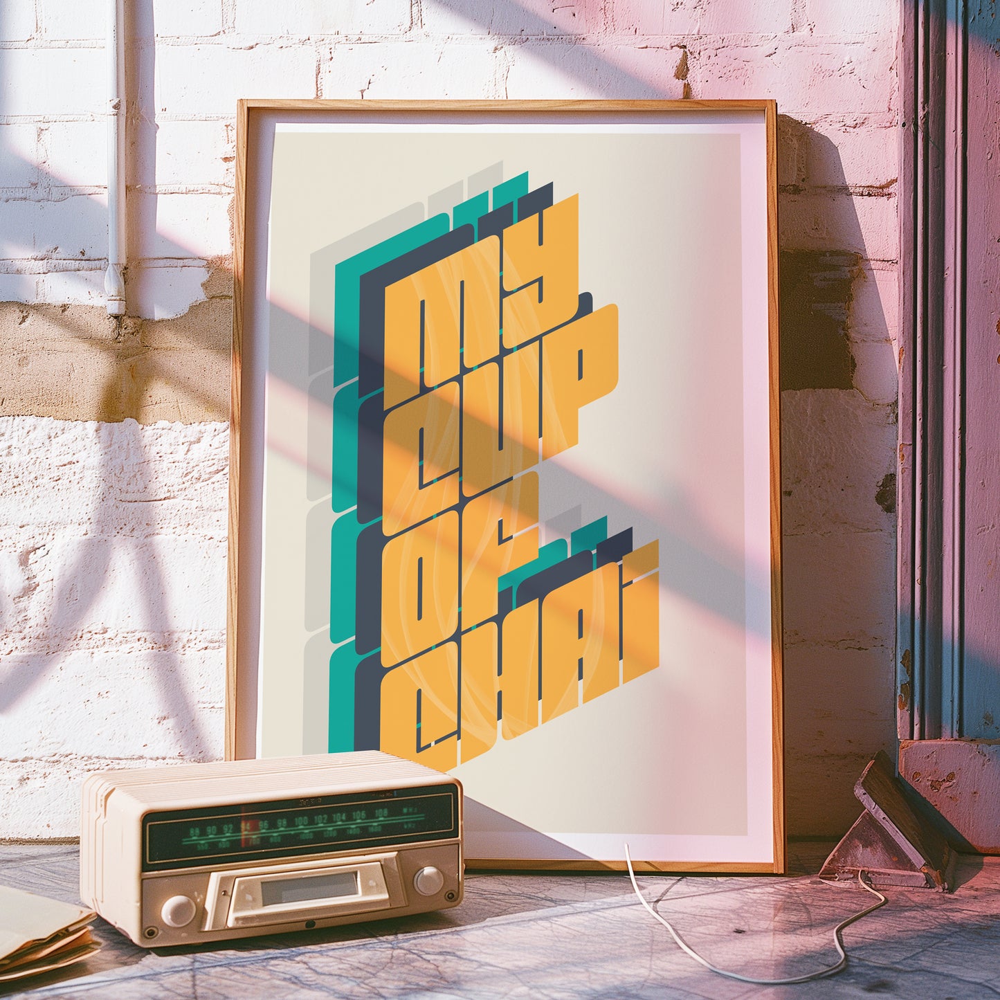 a radio sitting next to a poster on a wall